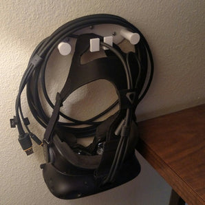 Supporto a parete per visore VR con porta cavi