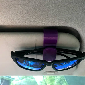 Supporto per occhiali da sole per il parasole dell'auto