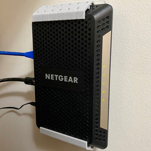 Montaggio a parete Netgear CM600 / CM1000 – Ottimizza la configurazione della tua rete